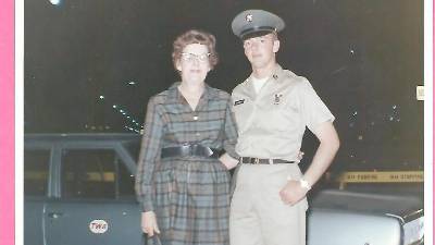 Daniel H. Burrows with his mother at the airport