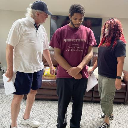 David Patrick Wilson, Emmanuel Stevens and Mariela-Christine Ramos rehearse “Supper With Ja,” a modern reimaging of “The Passion Play” that redefines Christ’s relationship with his disciples.