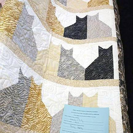 Quilt by Sally Hubley, named for her cats Louis and Tilly