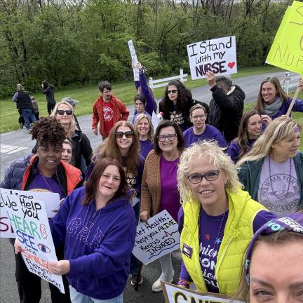 Nurses pose for a photo at the informational picket outside Garnet Health April 30.