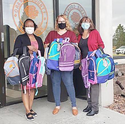 Pictured left to right are: Rasheena Wilson, Junior League of Orange County Backpack Committee; Kim Regensdorfer, Senior Caseworker Orange County Department of Social Services; and Trish Chelsen, JLOC President-elect and Backpack Chairwoman. Provided photo.