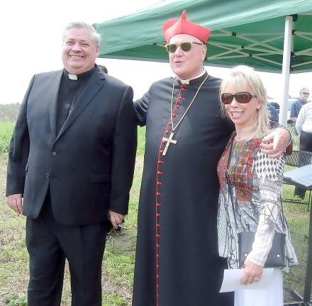 The Rev. John Bonnici, pastor at St. Columba in Chester, Cardinal Dolan and Carolyn Palmer, whose family donated the property for the cemetery expansion.