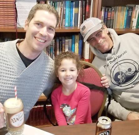 Sofia Greenberg of Goshen, with her Dad, Dave and grandfather, Alan, of Pine Bush, at A&amp;Wesome Aba Father’s Day event at Chabad Hebrew School.