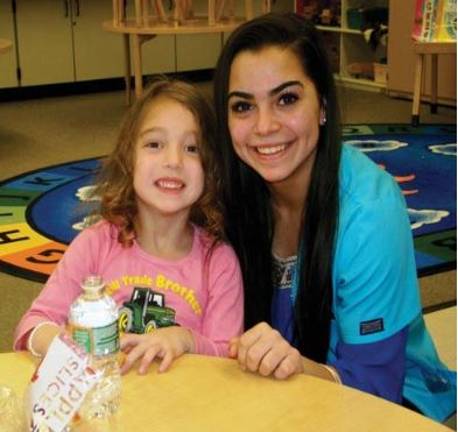 Amanda Almodovar with one of the children at Chester's pre-school (BOCES photo)