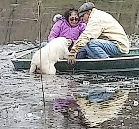 Suzyn Barron, president of the Warwick Valley Humane Society, and Ken Mitchell made their way to the stranded dog that had fallen into the icy water. Provided photo.
