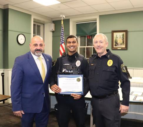 Goshen recognizes Officer Nigel Balgobin at town board meeting.