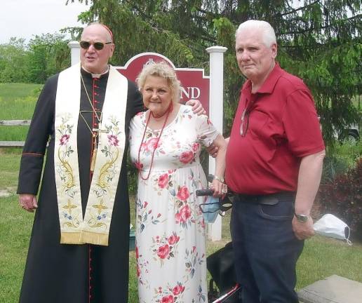 Cardinal Dolan with Ester and Michael McGarry, Board Members on the Blessed St. Joseph Foundation, that gave a grant to build the playground.