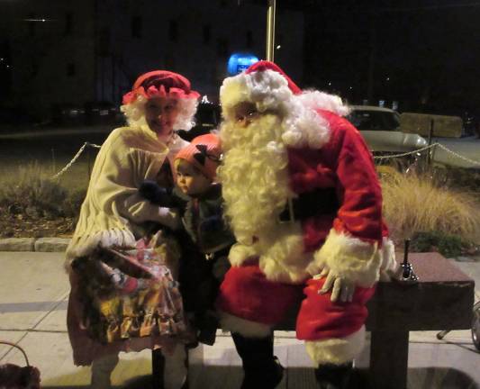 Declan Wintermute, 2, joins Santa and Mrs. Claus (Photo by Ginny Privitar)