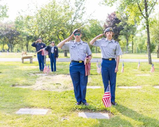 Minisink Valley High School JROTC cadets salute the fallen at Veterans Memorial Cemetery in Goshen, NY. Photo by Sammie Finch