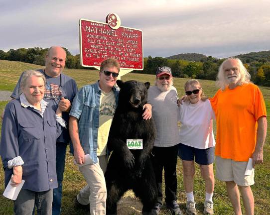 From left: Debbie Diltz, Brian Boone, Jay Westerveld, Sugar Bear (descendant of slain bear), Tim Diltz, Diane Westerveld, and Peter Lendved.