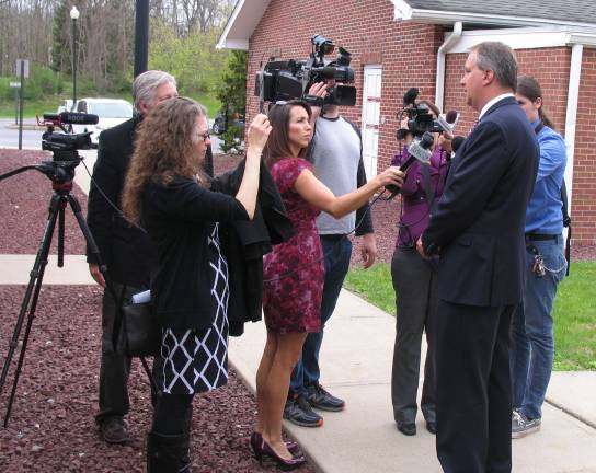 Photos by Roger Gavan Orange County District Attorney David M. Hoovler speaks with reporters outside Warwick Town Court Thursday, April 28, following the arrest of 18 people in connection with a cocaine distribution network in Orange, Sullivan and Sussex counties.