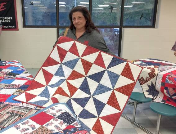 Carolina Difrenna of Milford with her first lap quilt