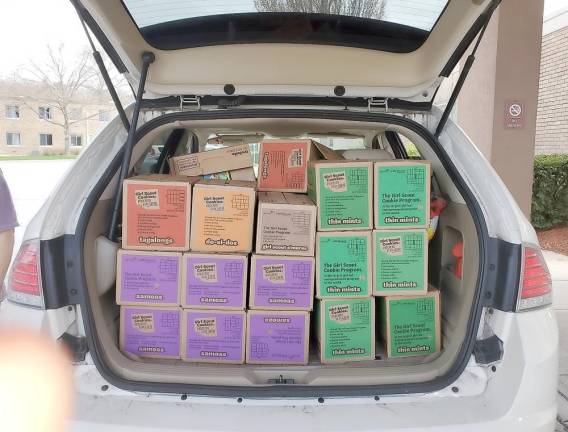 This is what $1,446 worth of Girl Scout cookies looks like.
