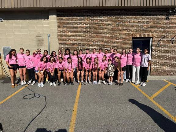 The girls soccer team took the first shift washing cars.