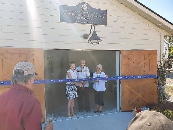 From left: Janet Terhune, Bill Murray, and Linda Myers at the Fleming Barn ribbon cutting.
