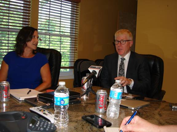 Julie Estrada and John Ussher discuss the Legoland Park they're hoping to bring to the Town of Goshen (Photo by Geri Corey)