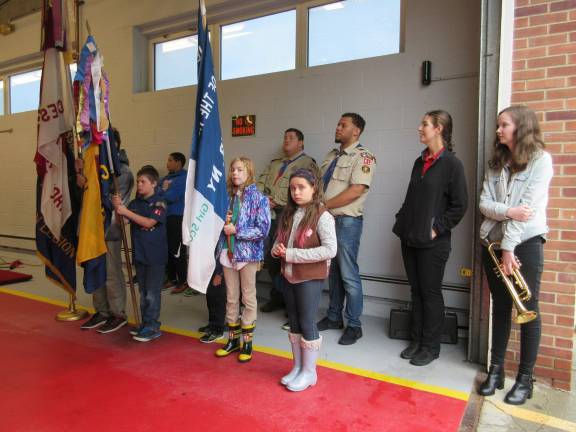Girl and Boy Scouts were part of the color guard. Bridget Burke, far right, played Taps. (Photo by Ginny Privitar)