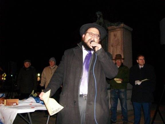Rabbi Meir Borenstein sang Hanukkah songs with brio during the joyous celebration (Photo by Geri Corey)