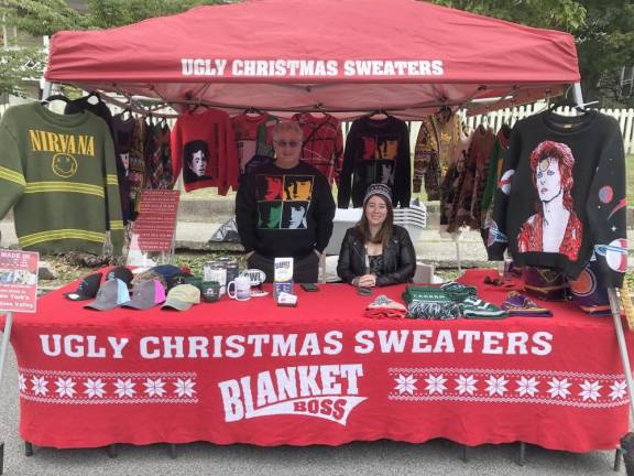 Boss Blanket’s booth, featuring several Ugly Christmas Sweaters.