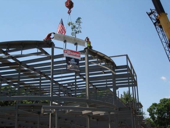 Workers from Gilbane Building Company in Albany fit the last steel beam into the framework of the new Goshen Public Library and Historical Society during the "Topping Off” ceremony held on June 29 (Photo by Geri Corey)