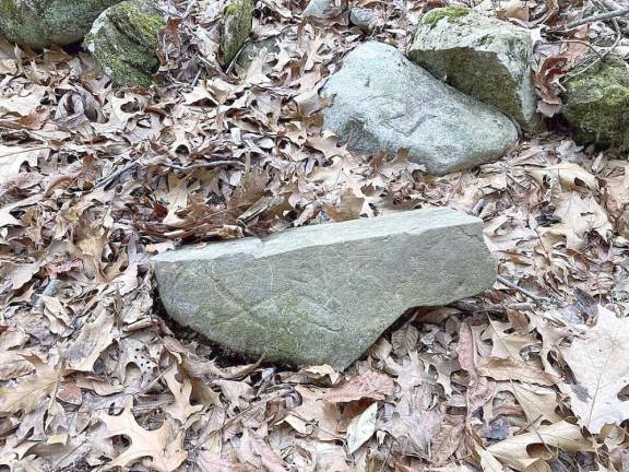 Does X mark the spot? This marked stone was found in the woods of Sussex County, NJ.