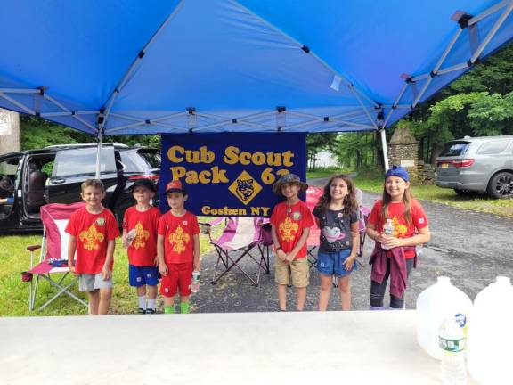Goshen Cub Scout pack 62 handed out water to 10k runners at the Knoell Road stop.
