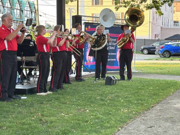The Broome Street Marching band, with Shary Kranch on the white sousaphone performs at Veterans Park.