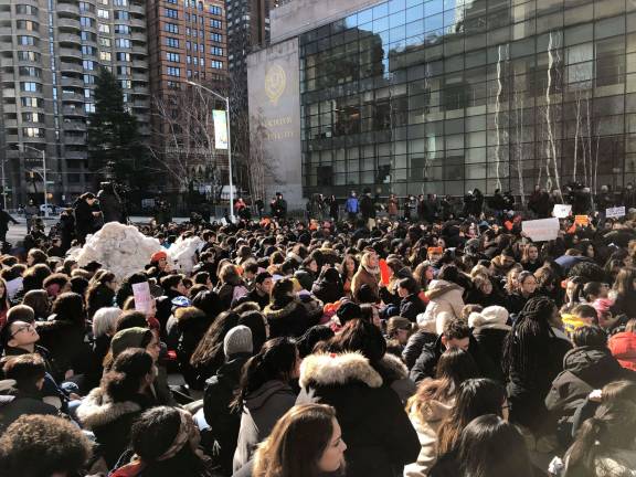 Students from Fiorello H. LaGuardia High School and other Upper West Side schools on West 62nd Street near Columbus Avenue at a walkout this morning during which they both commemorated the 17 killed in Parkland, Florida, four weeks ago and demanded action from legislators on gun control. Photo: Ashad Hajela