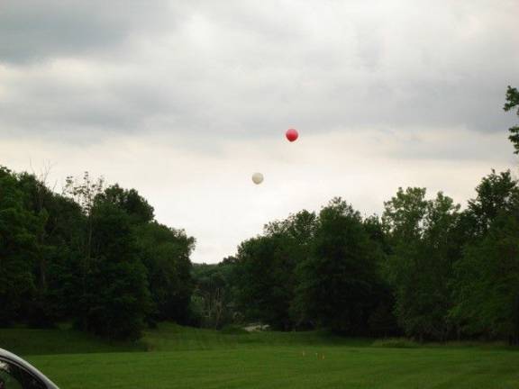 Balloons at two heights &#x2014; 45 feet for a flat roof and 63 feet for a peaked roof (Photo by Geri Corey)