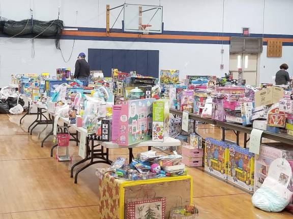 Kiwanians sorting toys before packing them up for families who had registered for Toyland.