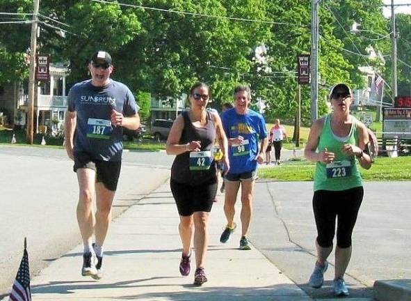 Brisk walking through the streets of Chester at last year's Hambletonian Trot (Photo by Ginny Privitar)