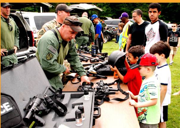 Children inspect a display at Emergency Services Day (Photo by Ed Bailey)