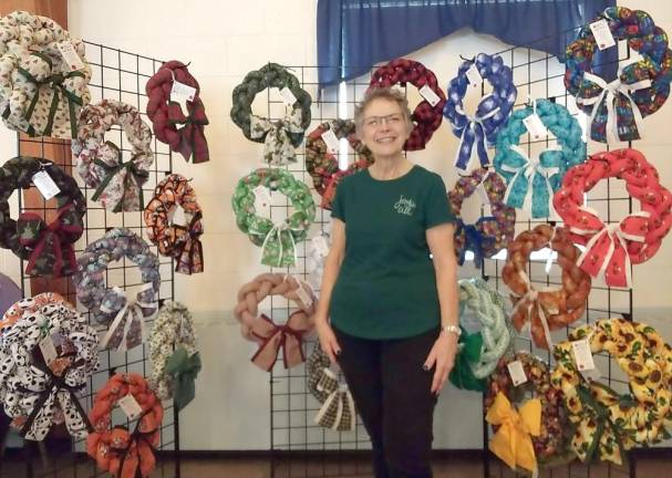 Esther Zaccone with cloth wreaths for sale