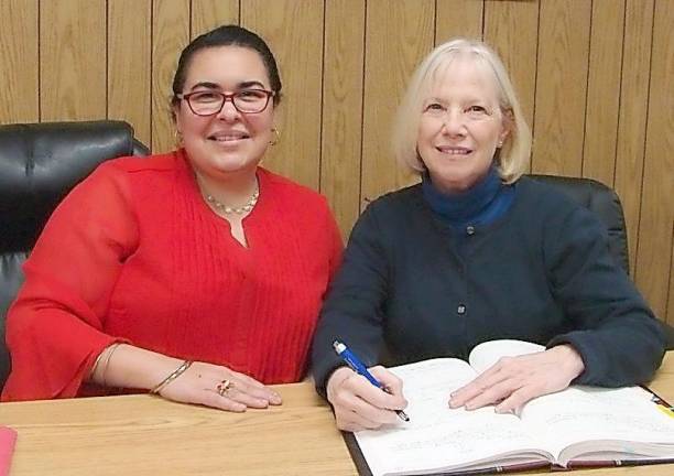 Nancy Hom George (right) signed on as the new Village of Chester Historian after being appointed by Mayor Tom Bell. Village Clerk Rebecca Rivera is pictured on the left.