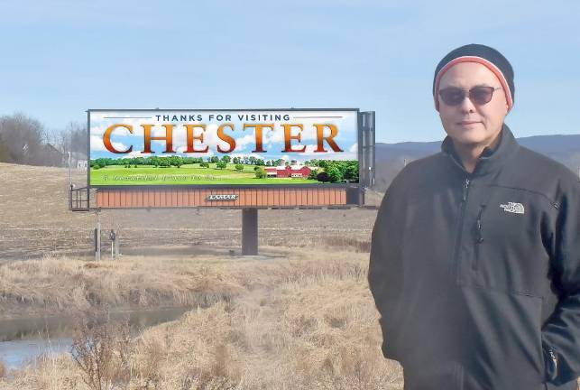 David Stevenson in front of one of the many designs he created for Lamar Co. to use on two billboards in Chester