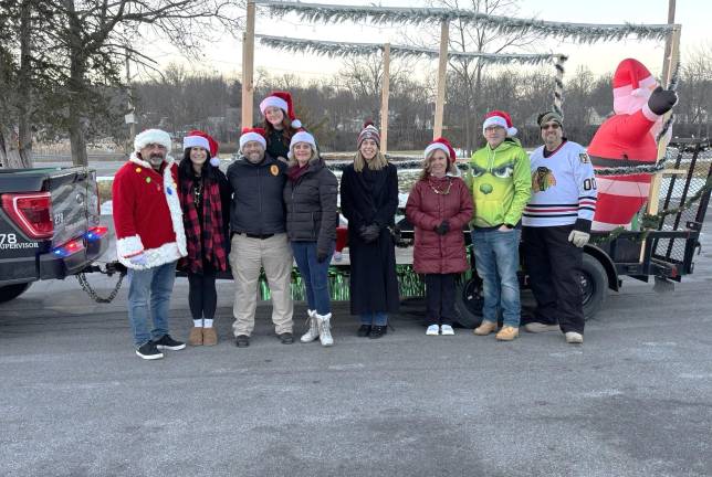 Town of Goshen employees with their Holiday Parade float, which was towed by the Town of Goshen Police Department.