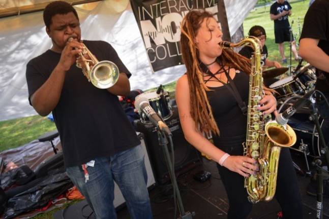 Photos by Nicole Spangenberg Gabriel Jasmin on trumpet and Lacey Liptak on sax perform during last year's Battle Candle Music and Arts Festival.