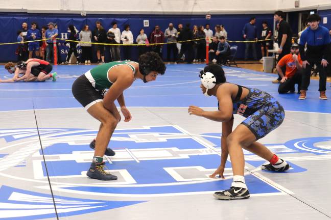 Dominick Jean-Pierre (right) is emerging as a leader in boys wrestling
