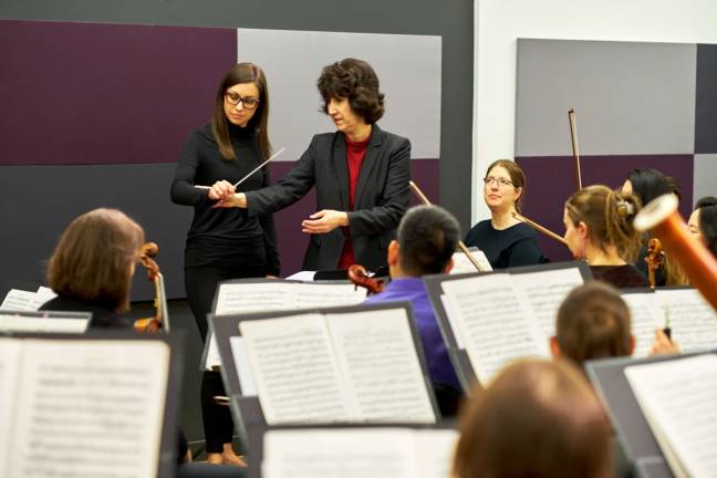 Erica Johansen, a workshop participant, with Diane Wittry, principal conductor of the Allentown Symphony Orchestra and the workshop&#x2019;s instructor. Photo: Douglas Bain
