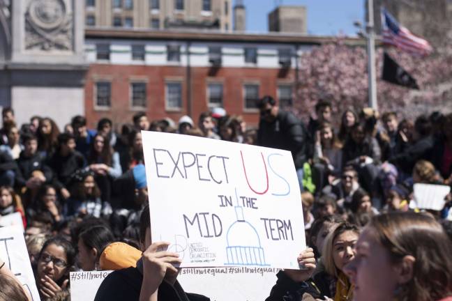 Student speakers and elected officials at Friday's Washington Square Park rally called on students and others to converge at the ballot box in November to vote for candidates who back stiffer gun-control laws. Photo: Photo: Jeremy Weine