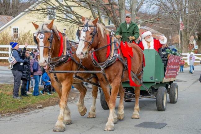 Kicking of the parade through Monre, Santa heads towards Rest Haven in a horse drawn carriage