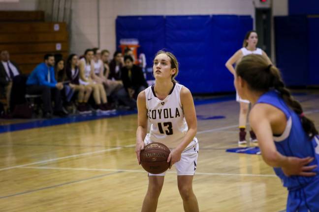 Tori-May Della Pace scored her 1,000th career point in her senior season and led the Loyola School Lady Knights to the NYCAL championship. Photo: Mark Wyville