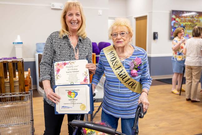 Melanie Tanner of Orange County Office for the Aging presented Sophie Halstead with recognition award as she celebrated her 100th birthday at the Senior Center in Chester.