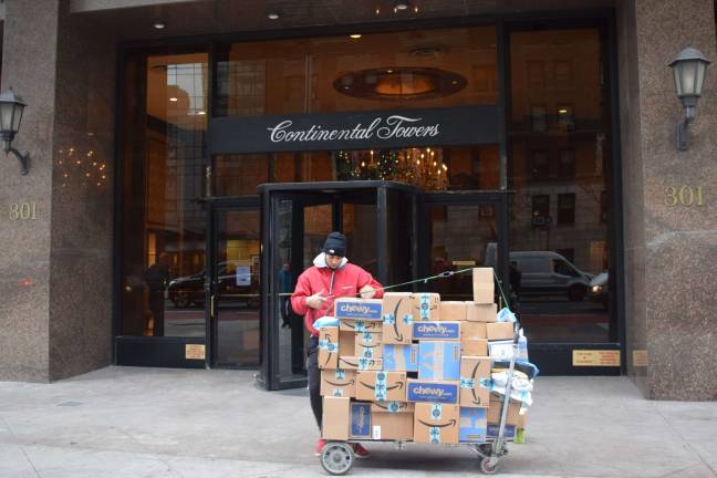 Staff at residential buildings feel the brunt of the online retail surge in December, fielding increased package deliveries. Photo: Michael Garofalo