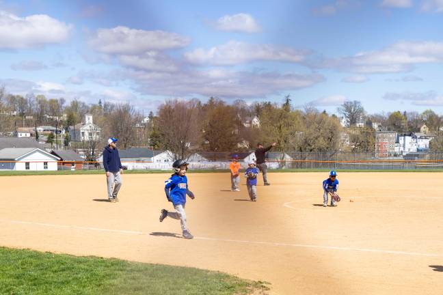 Jack Collins running to home base during his opening day game. Photo by Sammie Finch