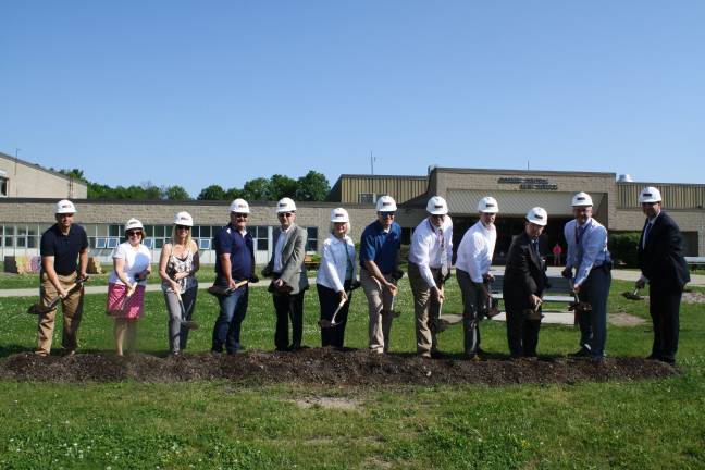 The ceremonial groundbreaking at Goshen High School. From left, Board of Education Members Michael Lorenzo, Martha Bogart, Allison Salte, Jeremy Cassel, Board Vice President Jason Pucci, Board President Judy Green, Matthew Milnamow, project manager at LAN Associates; Kevin Sawyer, vice president of Triton Construction; Computer Network Administrator James Sterett, Superintendent Daniel Connor, Goshen High School Principal Robert McKiernan, Goshen High School Assistant Principal/Athletic Director Matthew O’Brien. (Photo provided)