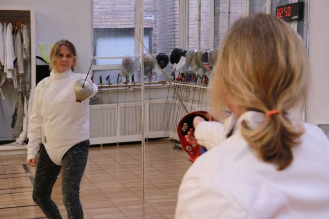 Reporter Genia Gould gets a fencing lesson on the Upper West Side. Photo: Matt Casey