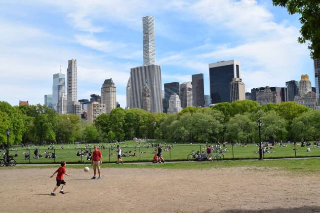 The former volleyball sandlot, in Sheep Meadow's northwest corner, with a transformed skyline as a backdrop, is now typically used for pickup soccer games. Photo: Michael Garofalo