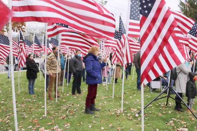 Those at the Rotary Club’s ceremony filled the rows of American flags at Charles J. Everett Memorial Park in the center of Goshen.