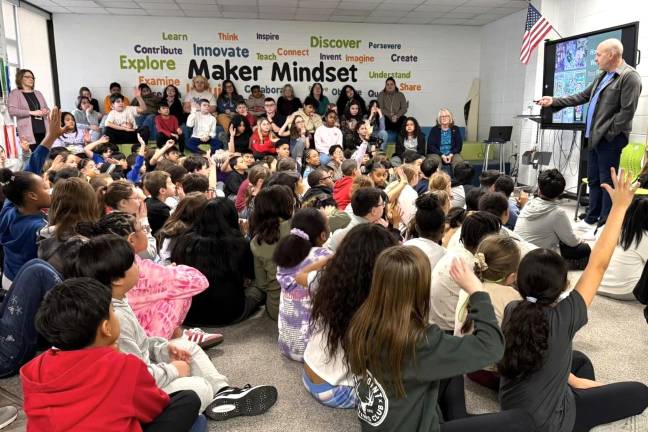 Chester Elementary students welcome author Eric Luper.